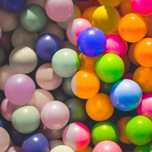 a colorful ball pit, but one half of the photo is de-saturated