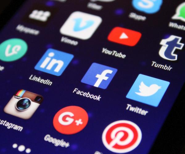closeup image of a smartphone showcasing all of its social media apps