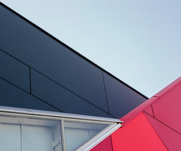 abstract image with red, grey, dark blue and light blue triangles