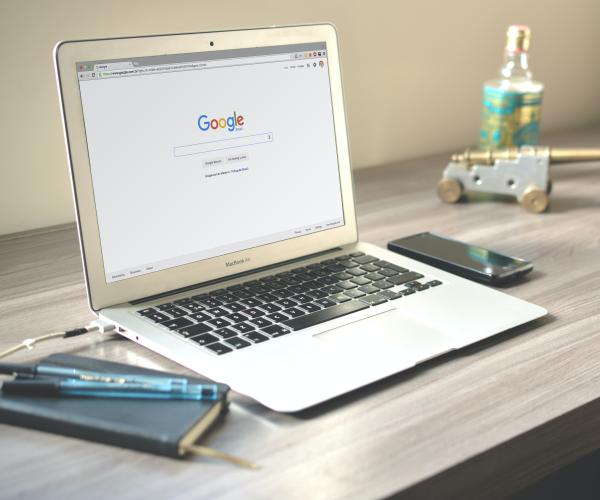 a laptop with google open on the screen