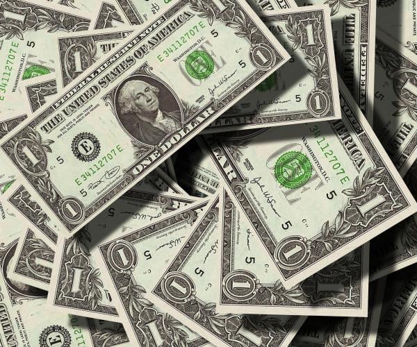 a pile of 1 dollar bills