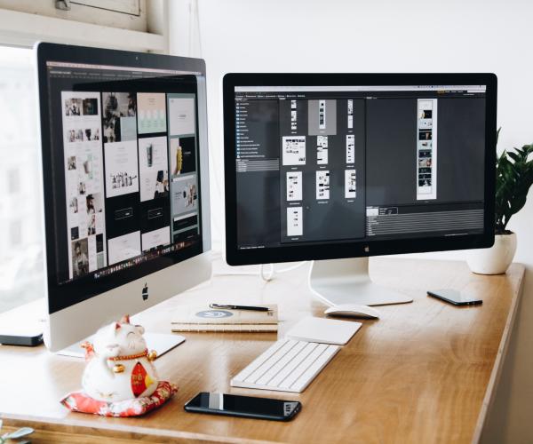 two monitors on a desk