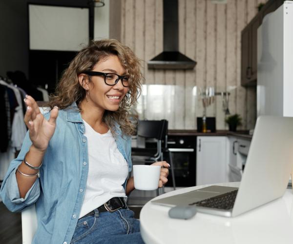 Woman sitting down for a video call.