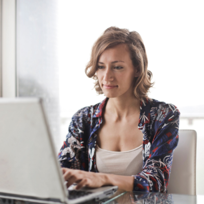 Woman staring at her laptop.
