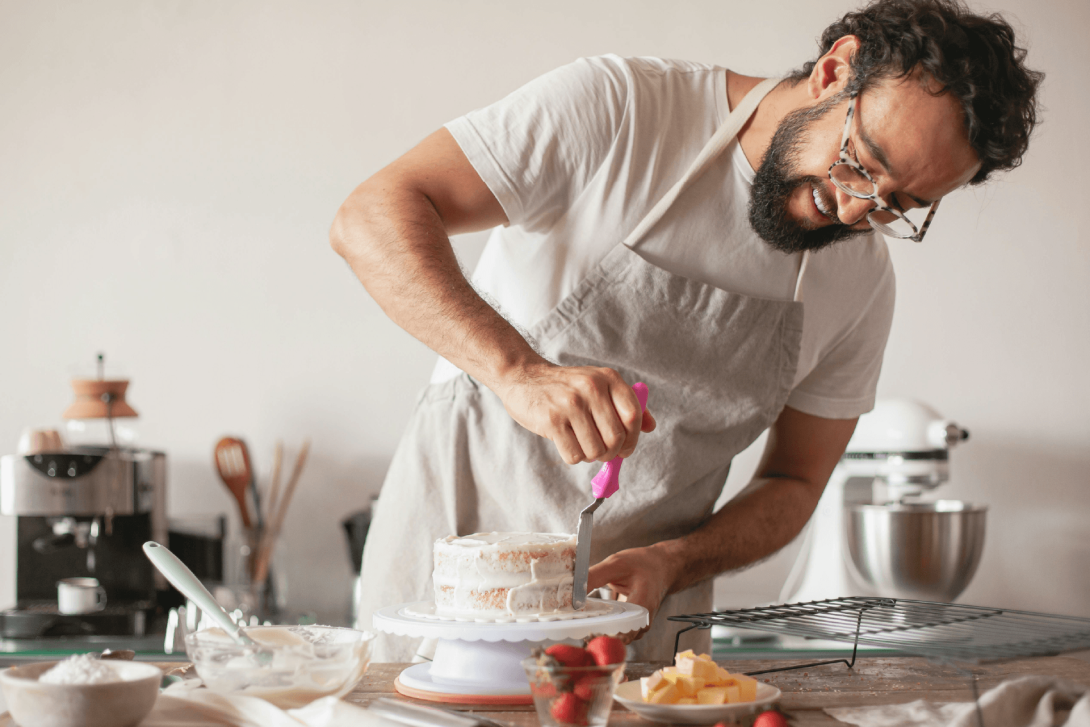Man making cake for his small bakery business.